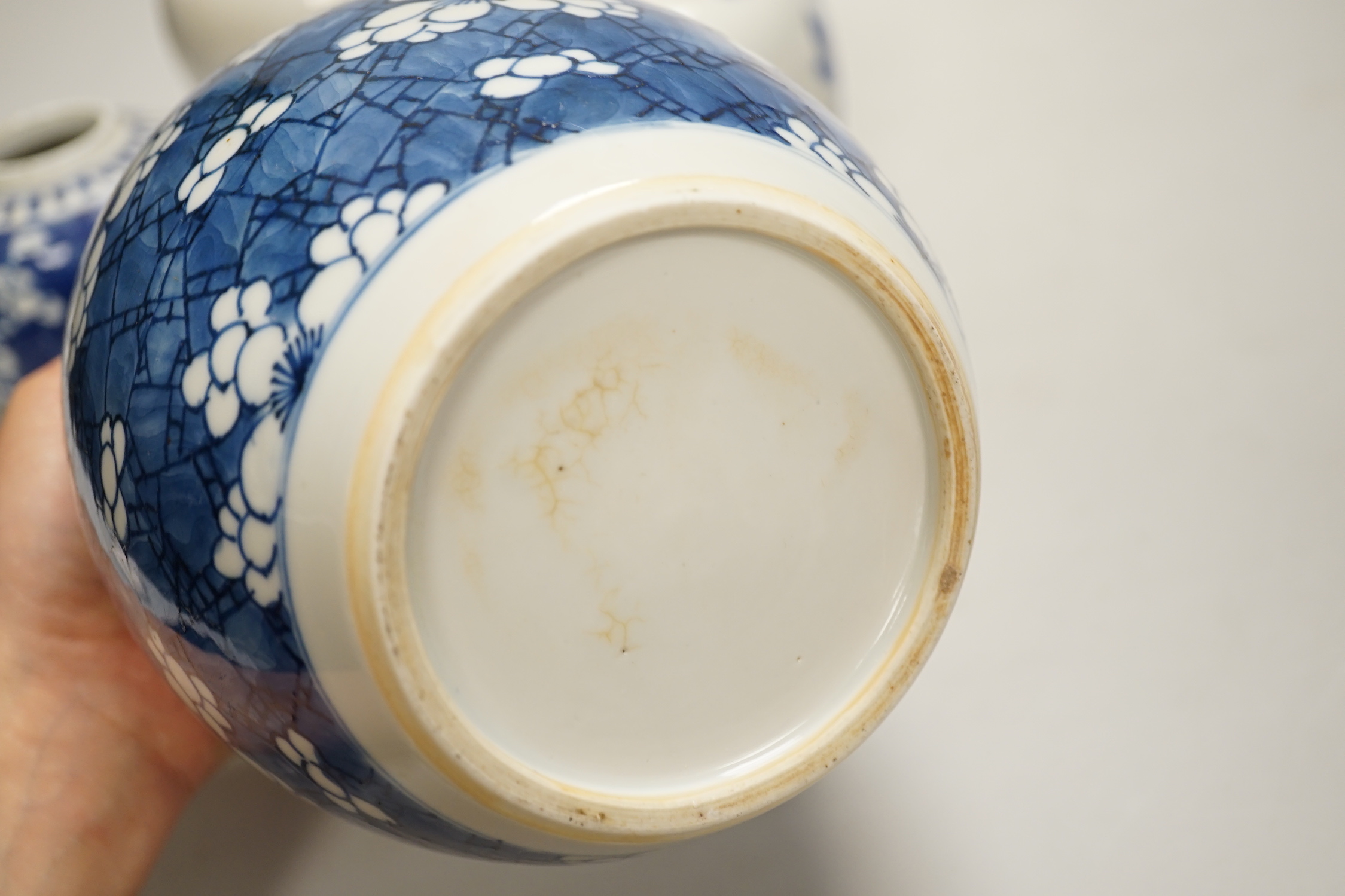 An 18th century Chinese blue and white Prunus jar and three 19th century Chinese blue and white jars, tallest 16cm
